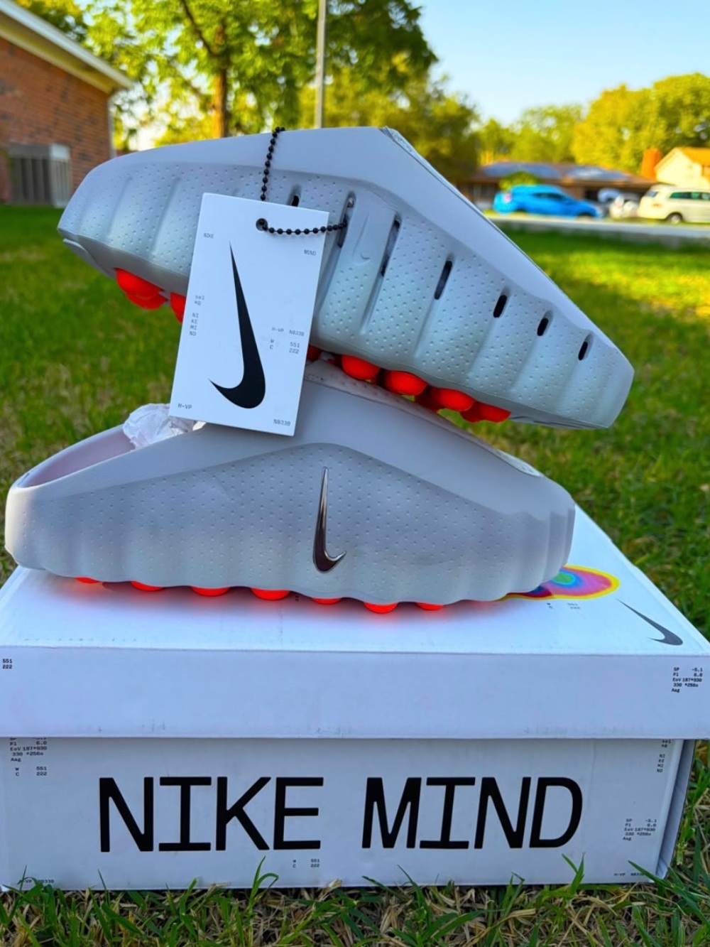 Nike Slide Sandals in Light Gray with Bright Orange Accents
